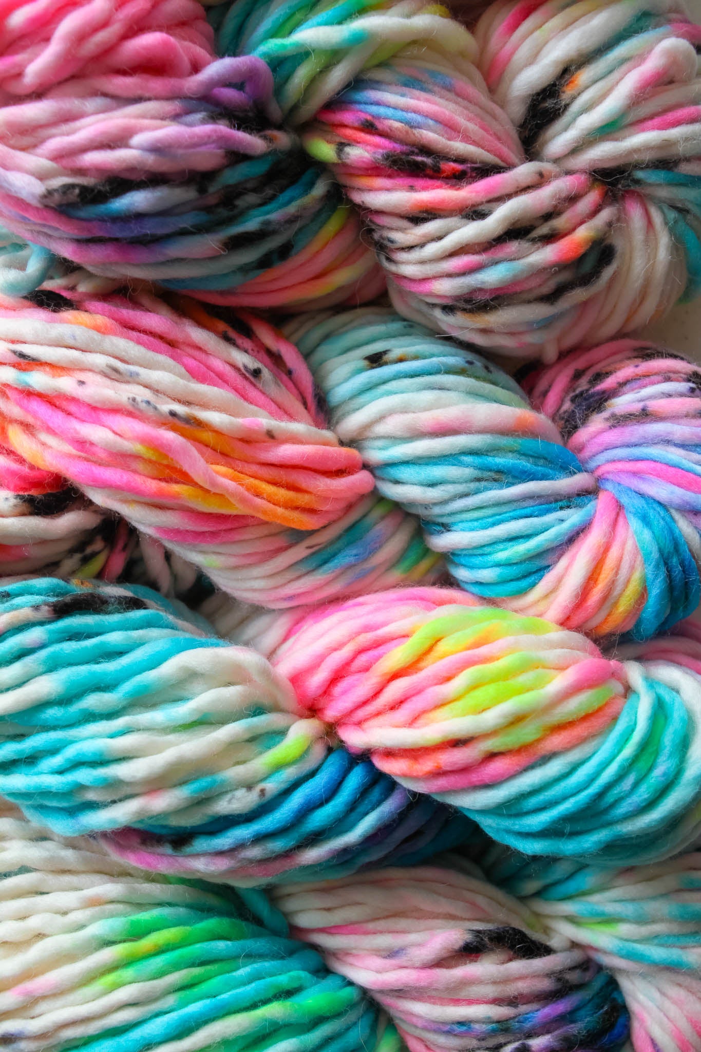 Multicolored yarn skeins in bright neon colorways