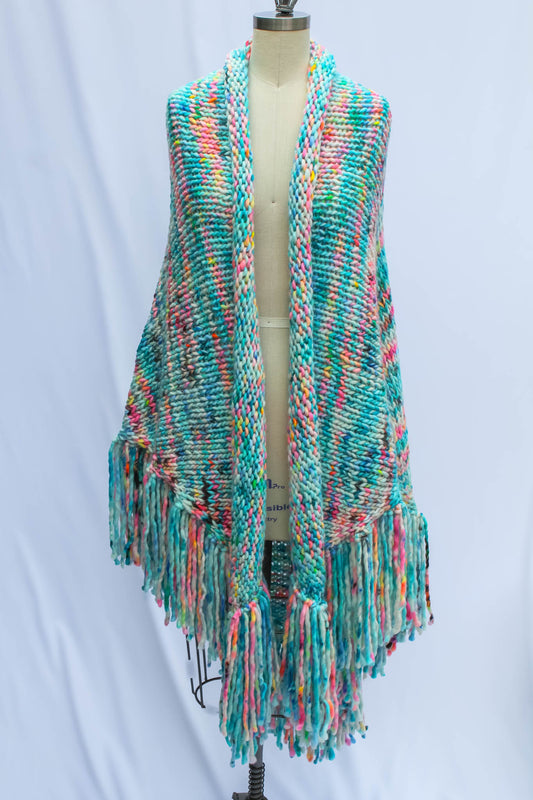 Luxury hand-knit shawl styled on dress form front view showing artful drape and texture. luxury shawl, fashion styling, wearable art, handmade couture, Rasa Milo