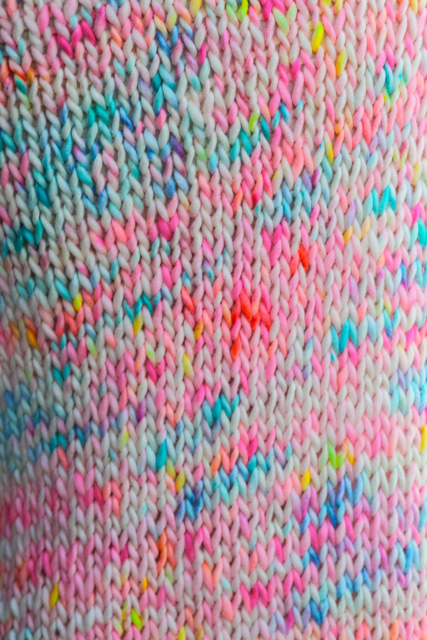 Detailed stitch view showing gradient sunset tones and artisan craftsmanship chasing sunsets, knit texture, colorway, hand dyed, artisan fashion
