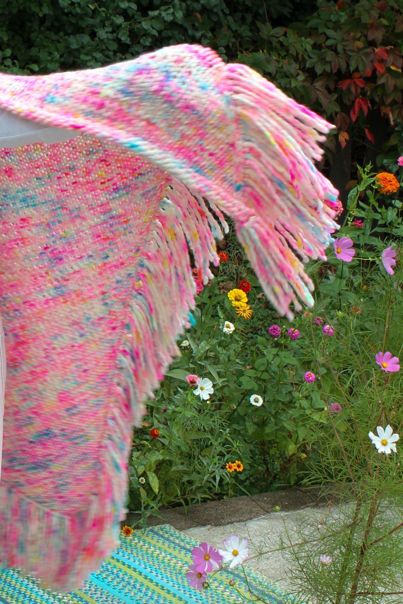 Sunset shawl fringe flowing in wind, alive with hand-dyed color chasing sunsets, hand dyed, fringe detail, wearable art, luxury fashion