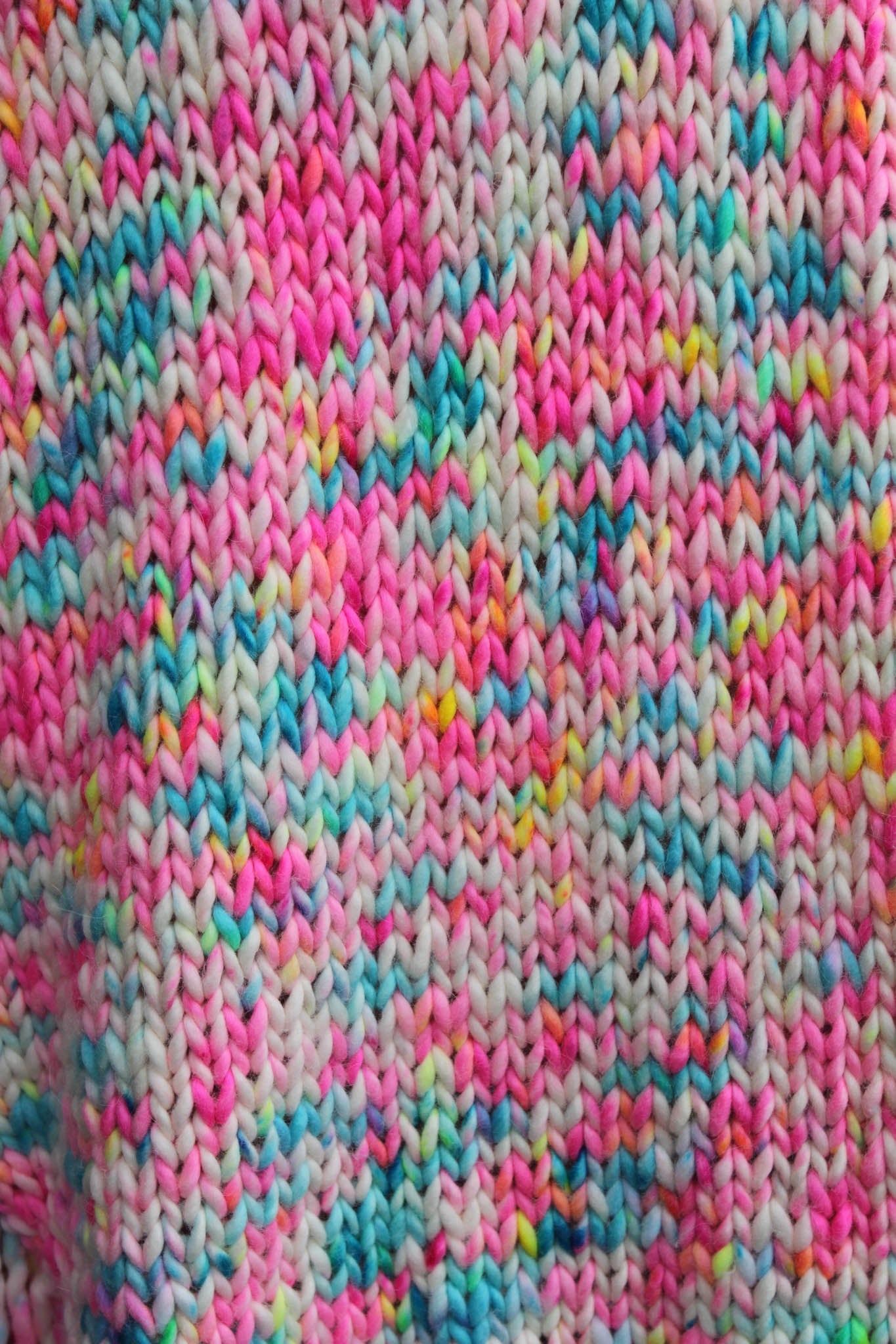 Close-up of Garden Confetti shawl hand-dyed stitches garden confetti, colorway, fringe detail, hand dyed, luxury knitwear