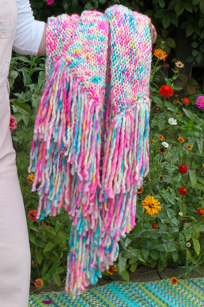 Garden Confetti shawl draped and folded over Rasa Milo’s arm art and color in motion. garden confetti, Rasa Milo, wearable art, luxury fashion