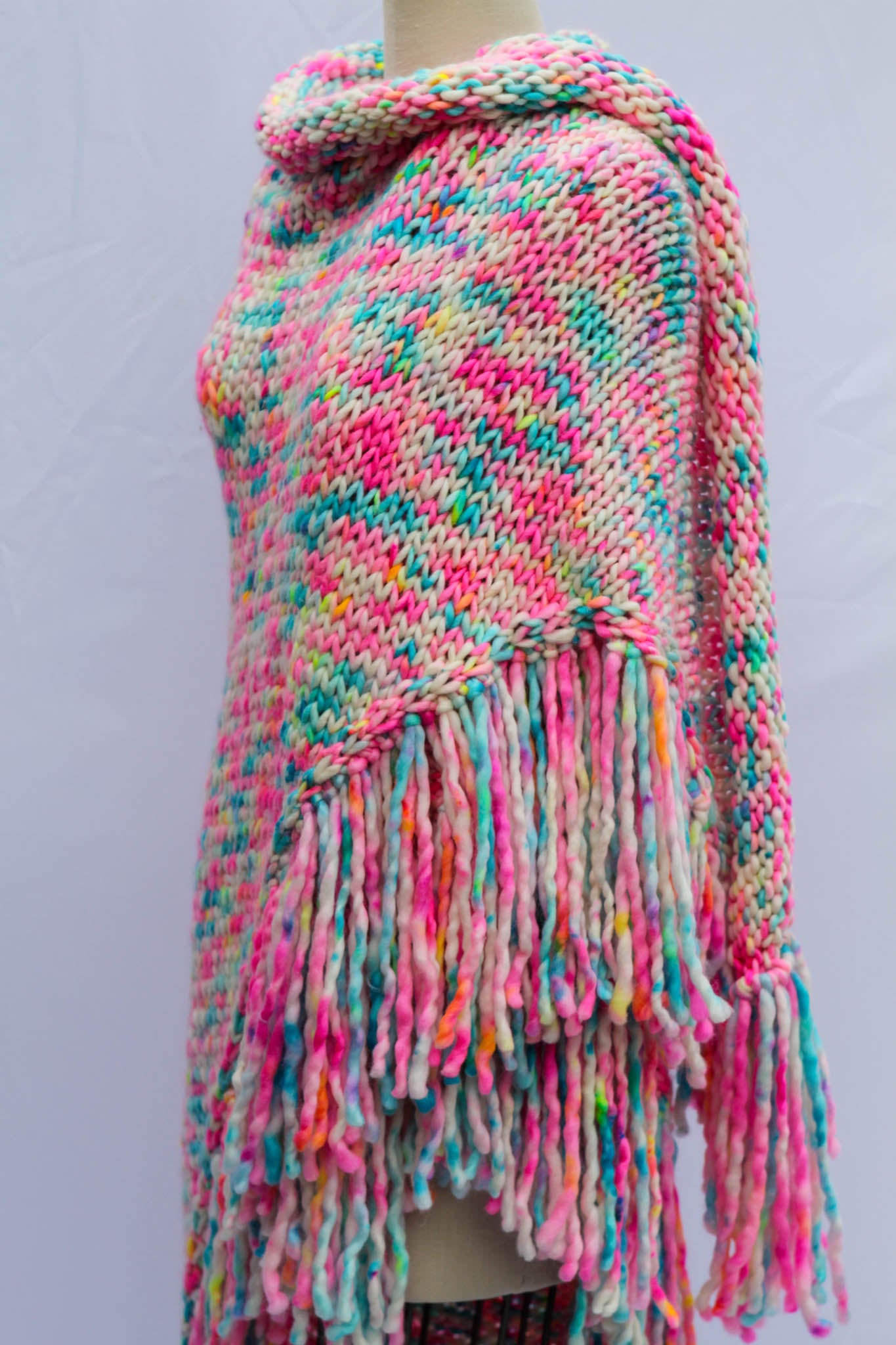 Each shawl is finished with hand-tied fringe that moves like color in motion