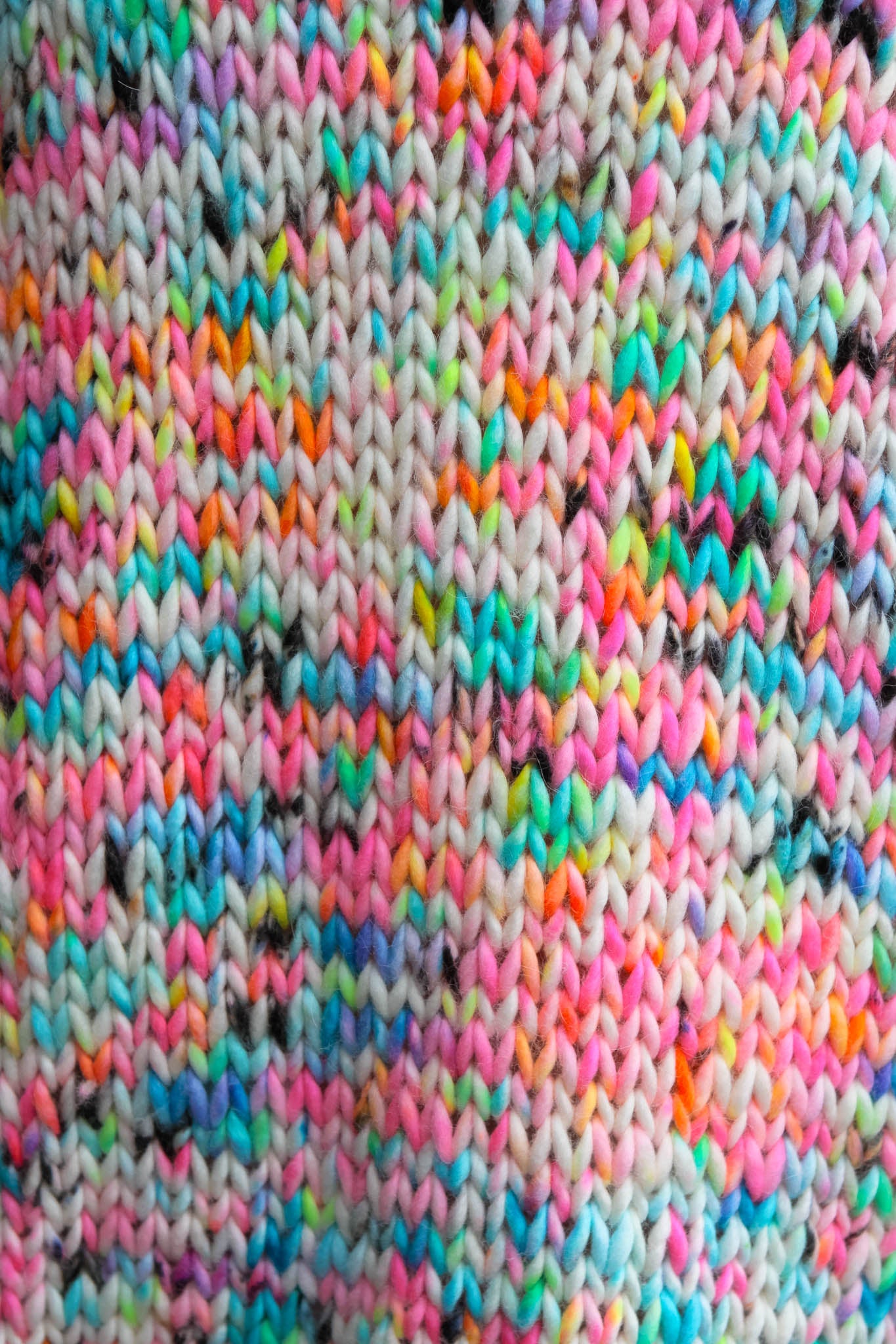 Color in motion, hand-dyed yarns becoming wearable art.