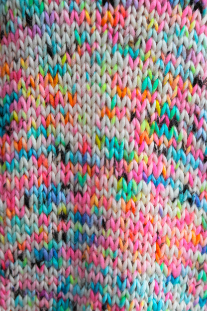 Color in motion, hand-dyed yarns becoming wearable art.