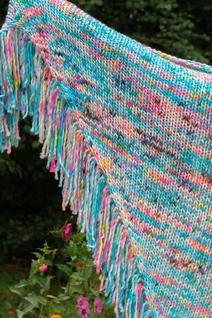 neon reef shawl held out by the corners full color and hand-dyed fringe displayed.
neon reef, fringe, artisan fashion, bold color, handmade